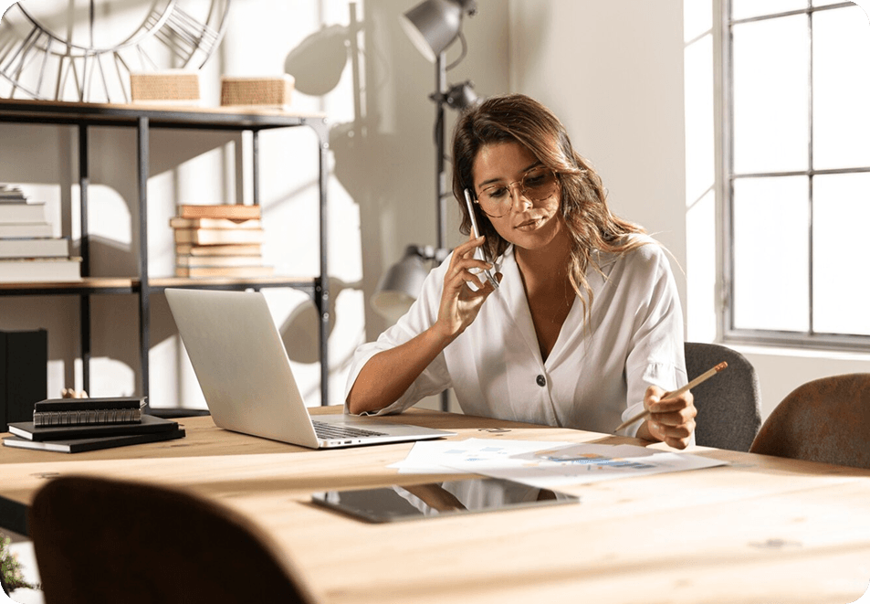 Person working at desk with laptop